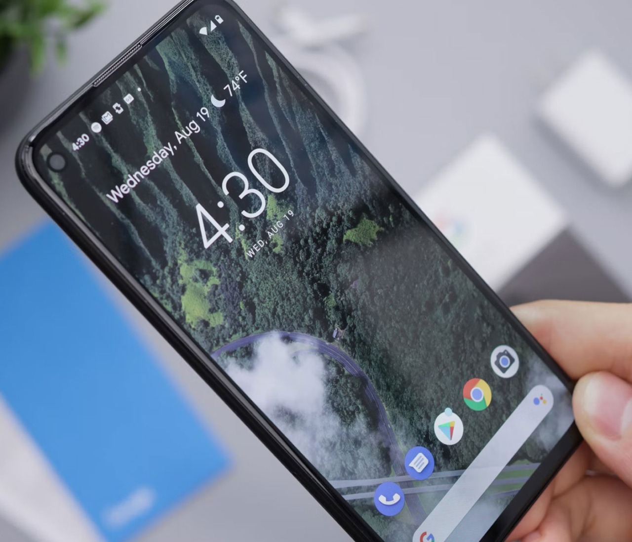 A photo of someone holding an Android mobile phone