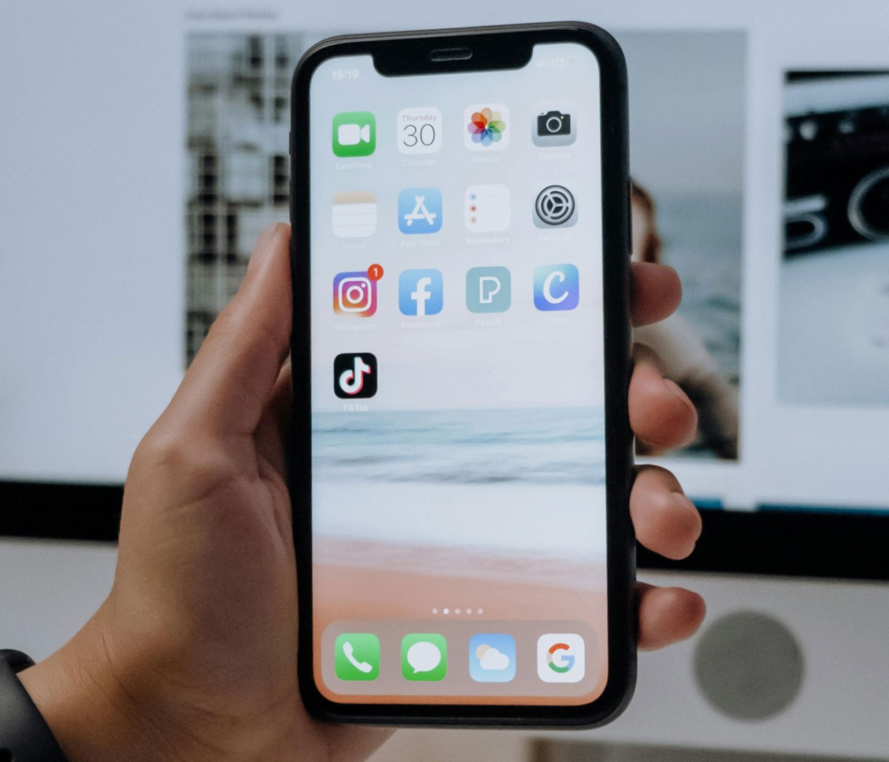 A photo of someone holding an iPhone